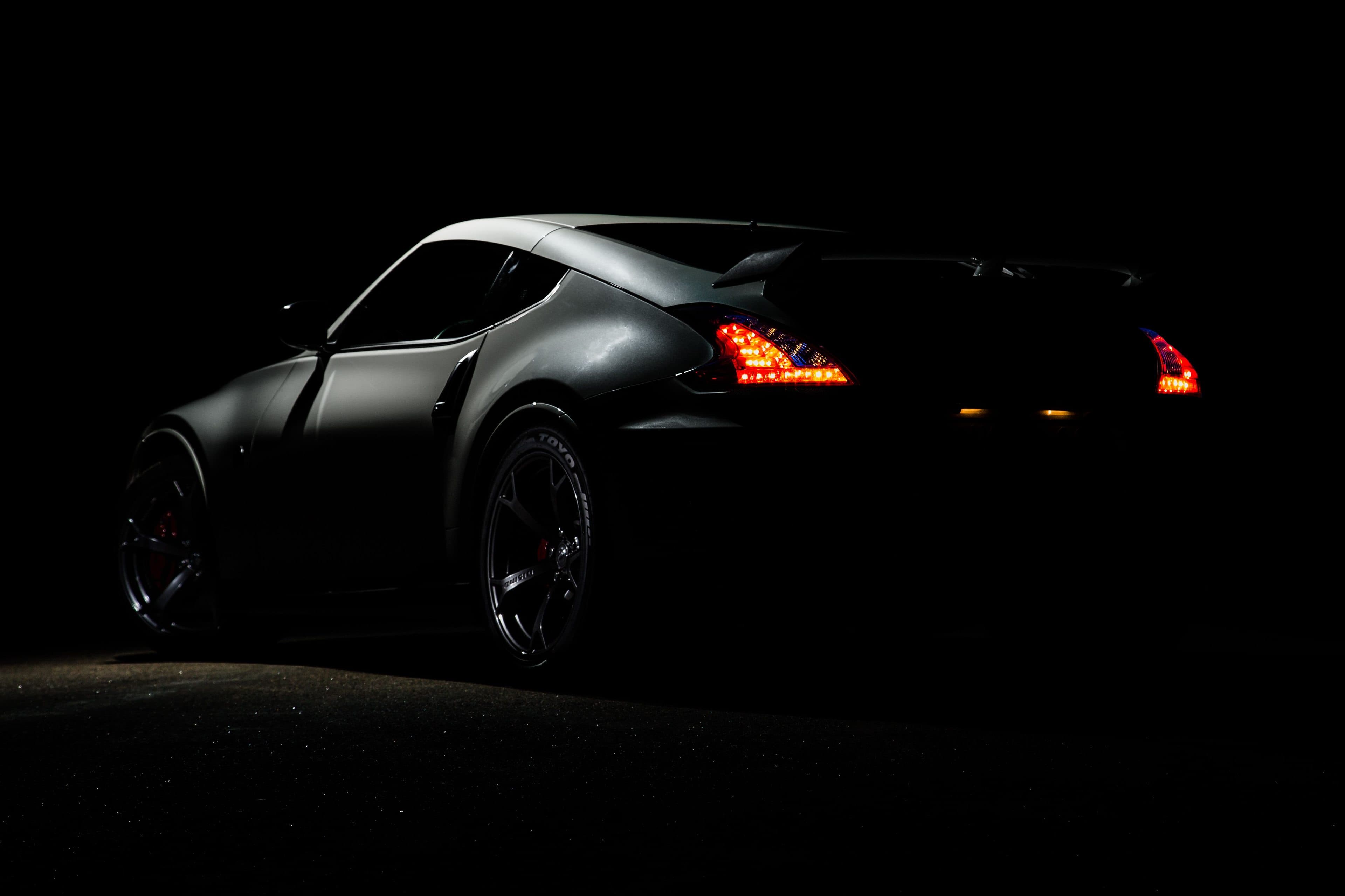 The Auriga GT in the dark, tail lights lit