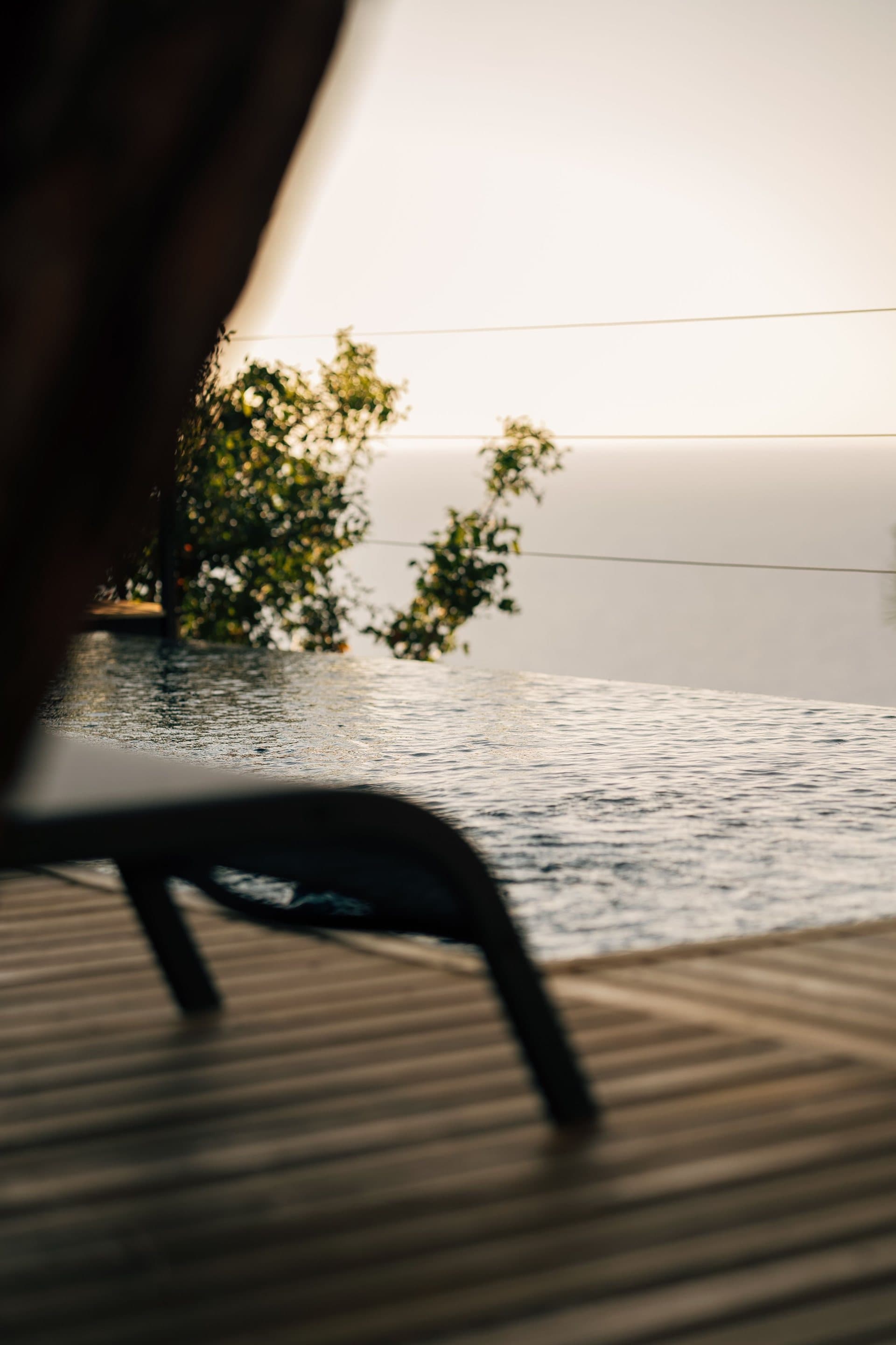 The saltwater pool at golden hour, sea beyond the edge